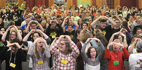 Area youth rock out to the Catholic sounds of the Carrie Ford Band in the Grand Ballroom of the Adams Mark Hotel during the 